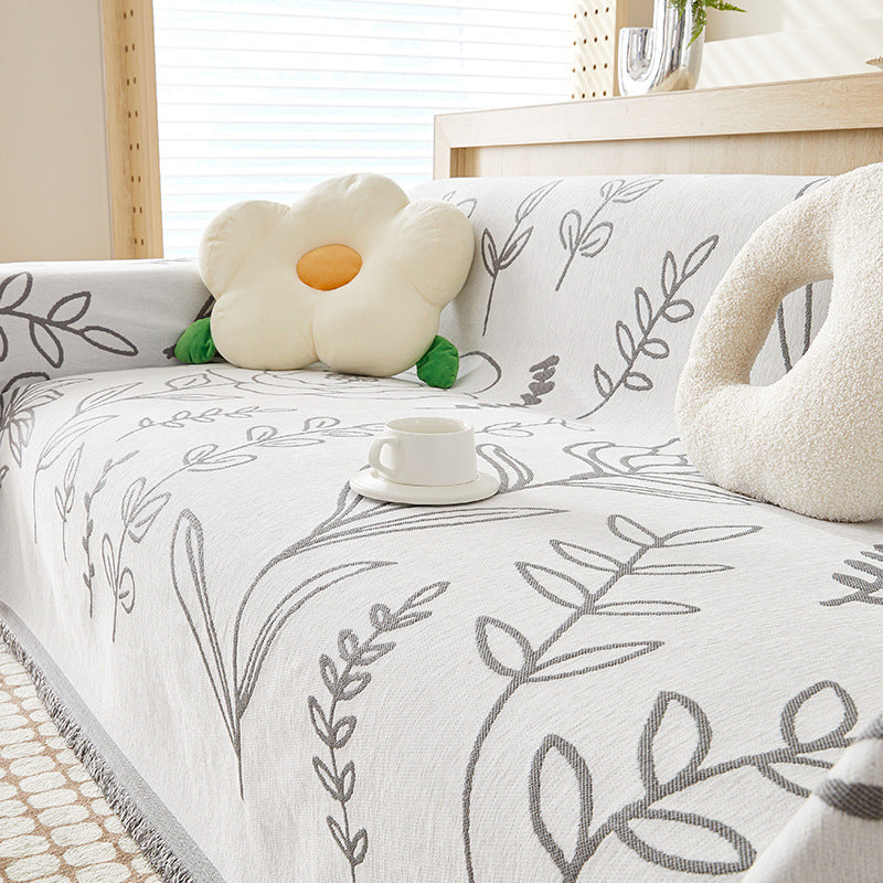 White chenille sofa throw with leaf patterns