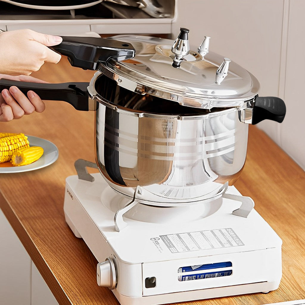 4L Commercial Grade Stainless Steel Pressure Cooker With Seal-image showing pressure cooker on a stove with a person opening the lid