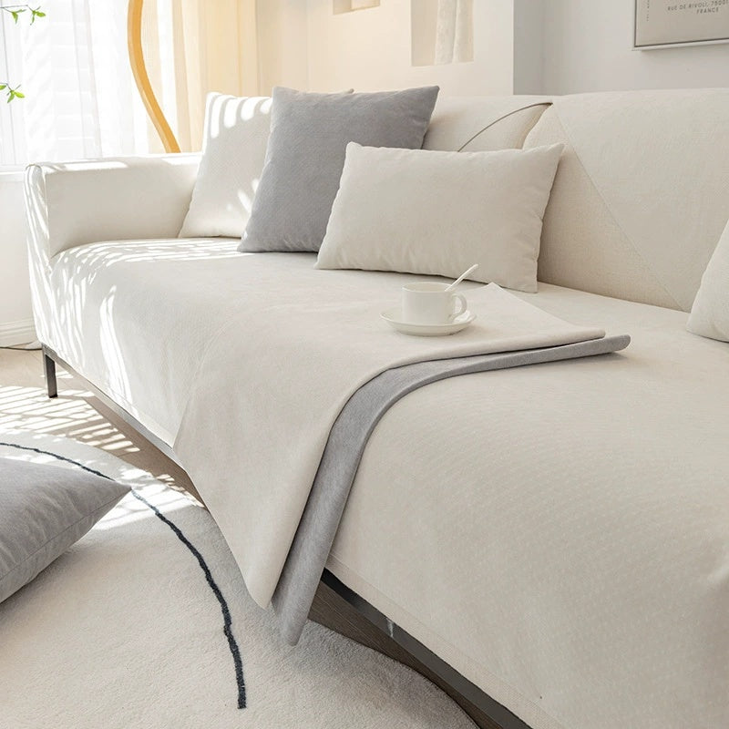 A plush chenille sofa cover in white, displayed on a sofa, including a close-up of the waterproof fabric texture.