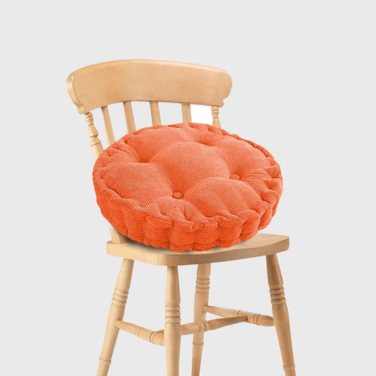 Orange plush round cushion for stylish home decor