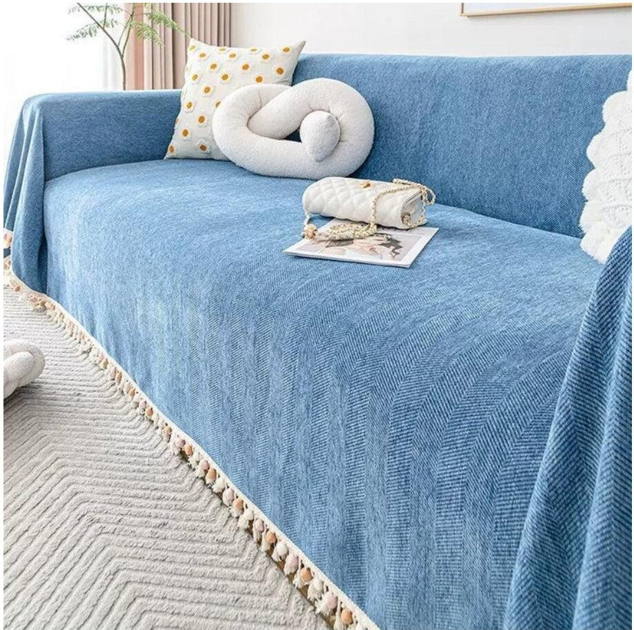 A warm living room styled with a Snug & Homely sofa cover